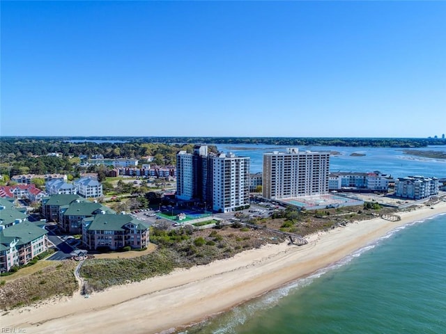 bird's eye view featuring a view of the beach and a water view