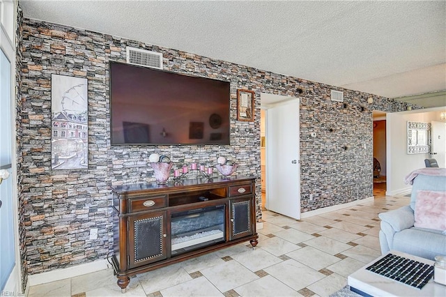 living room featuring a textured ceiling