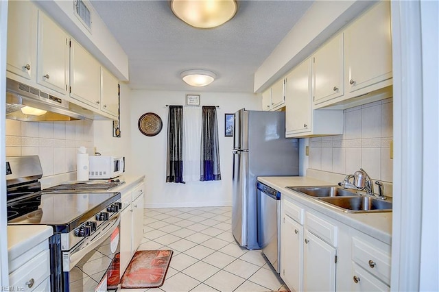 kitchen with sink, white cabinets, and stainless steel appliances