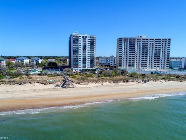 birds eye view of property with a beach view and a water view