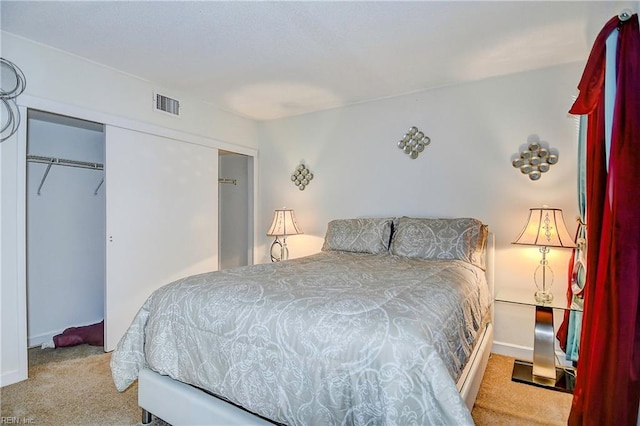 carpeted bedroom with a closet