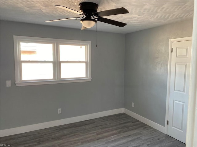 unfurnished room with ceiling fan and wood-type flooring