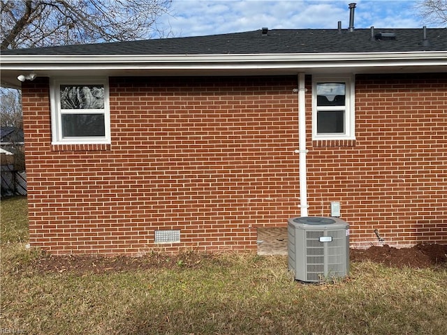 view of side of home featuring cooling unit