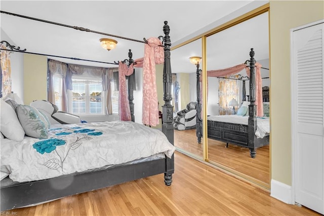 bedroom featuring wood-type flooring