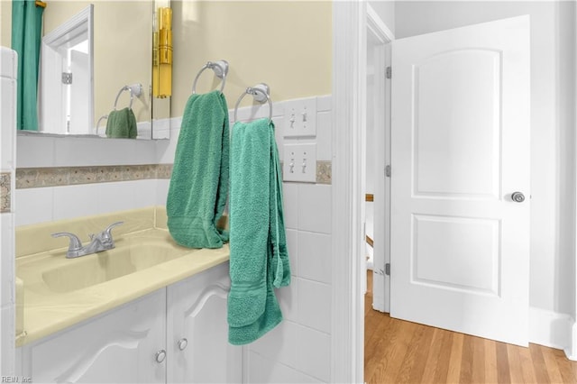 bathroom featuring wood-type flooring and vanity