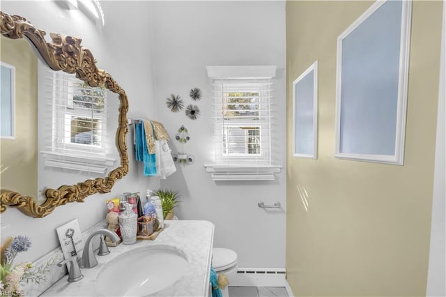 bathroom featuring tile patterned flooring, vanity, and toilet