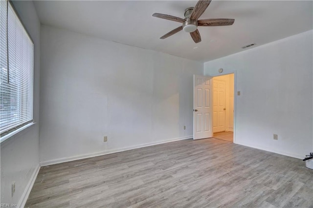 unfurnished room featuring ceiling fan and light hardwood / wood-style floors