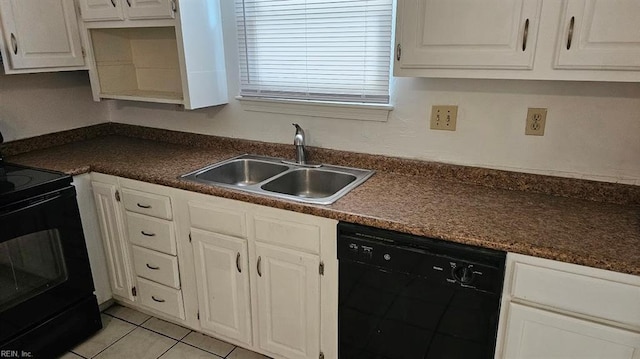 kitchen with white cabinets, light tile patterned floors, sink, and black appliances