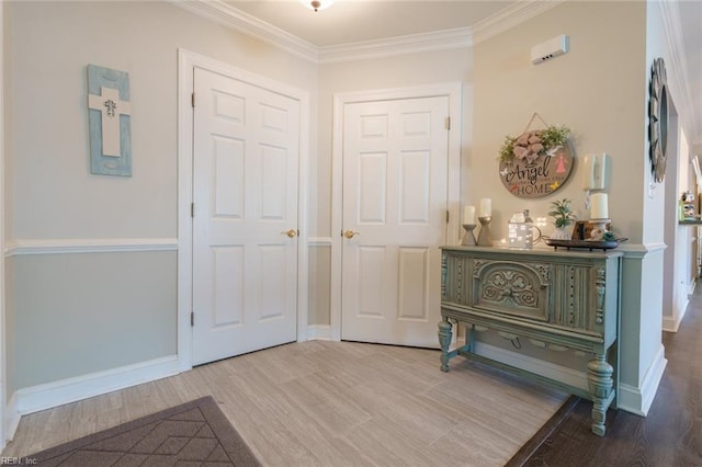 entryway featuring wood-type flooring and ornamental molding