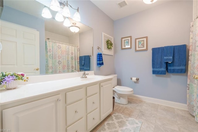 bathroom with tile patterned floors, vanity, and toilet