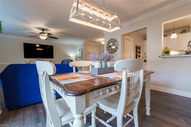 dining area with ceiling fan, crown molding, and dark wood-type flooring