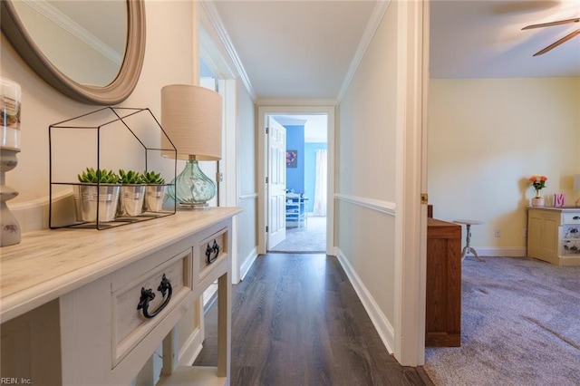 corridor with dark carpet and ornamental molding