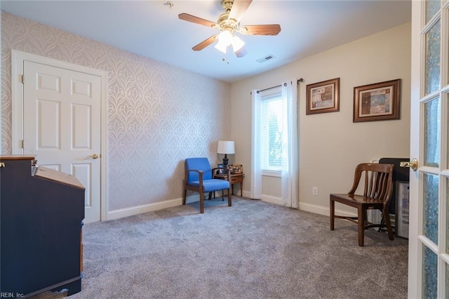 sitting room featuring carpet flooring and ceiling fan