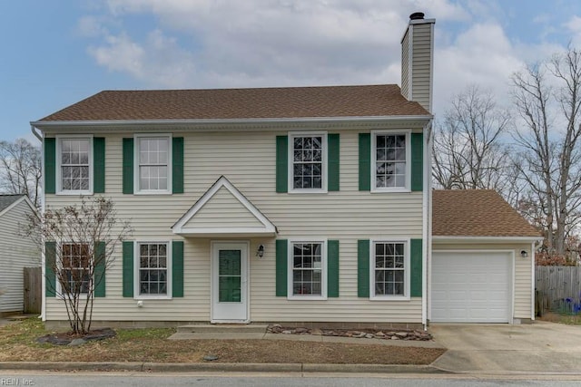 colonial home with a garage