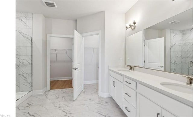 bathroom with vanity and an enclosed shower