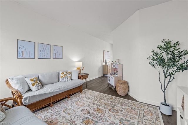 living room with dark hardwood / wood-style flooring