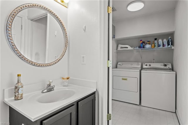 bathroom with vanity and washing machine and dryer