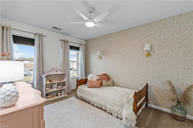 carpeted bedroom featuring ceiling fan