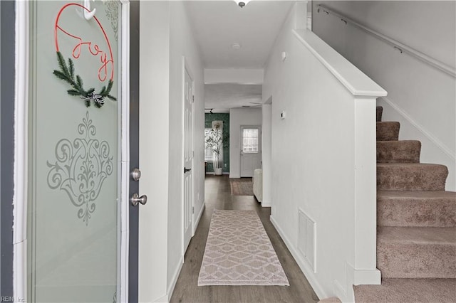 hallway featuring dark hardwood / wood-style floors