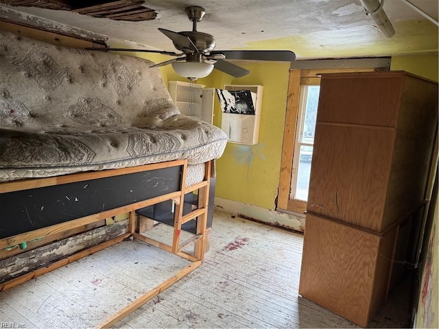 misc room with ceiling fan and light wood-type flooring