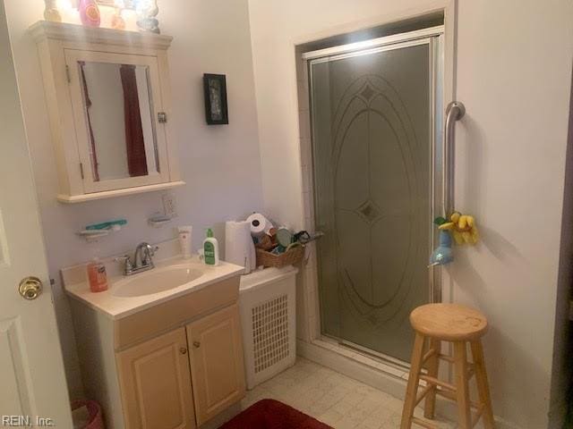 bathroom featuring vanity and walk in shower