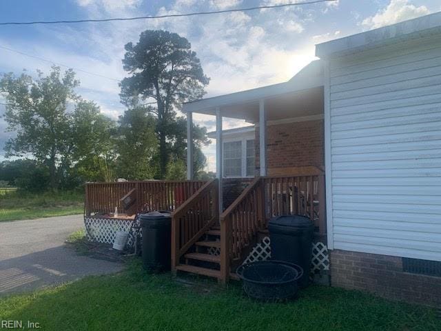 view of property exterior featuring a wooden deck