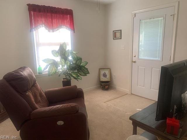 interior space featuring light colored carpet