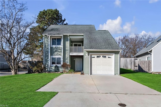 front of property with a balcony, a front yard, and a garage