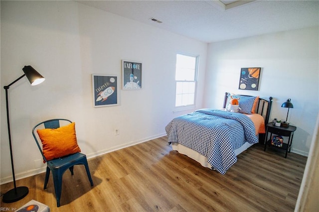 bedroom featuring wood-type flooring