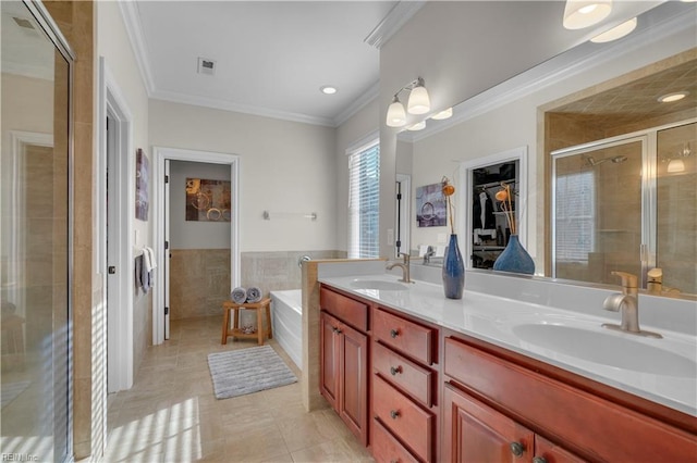 bathroom featuring tile patterned floors, crown molding, vanity, and shower with separate bathtub