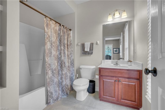 full bathroom featuring tile patterned flooring, vanity, toilet, and shower / bath combo with shower curtain