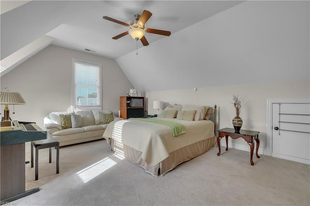 bedroom featuring light carpet, ceiling fan, and lofted ceiling