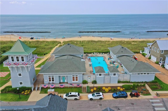 bird's eye view featuring a beach view and a water view