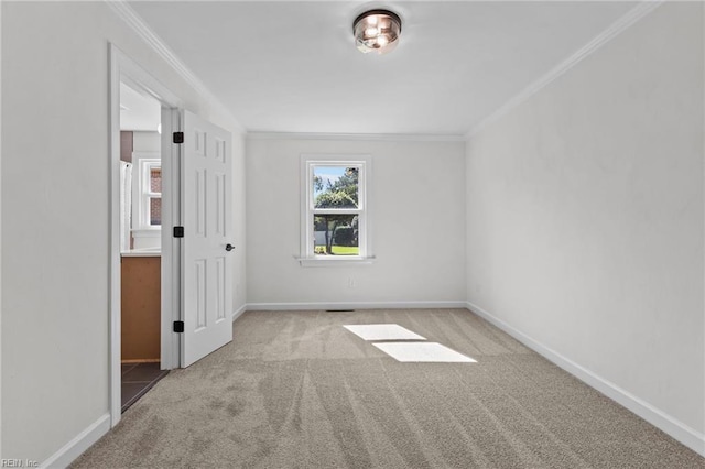 carpeted empty room with ornamental molding