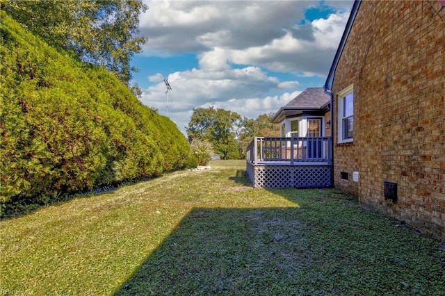 view of yard featuring a deck