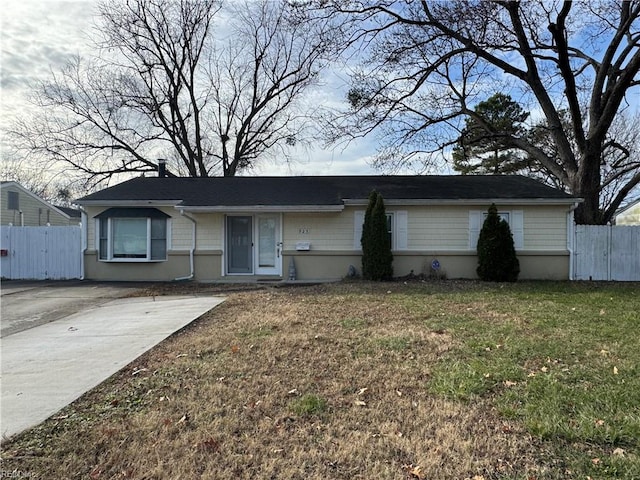 ranch-style home with a front yard