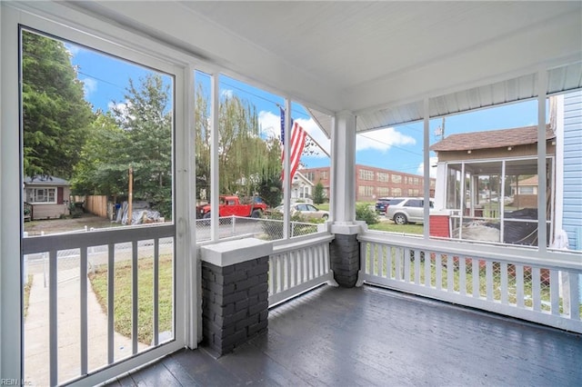 unfurnished sunroom featuring a healthy amount of sunlight