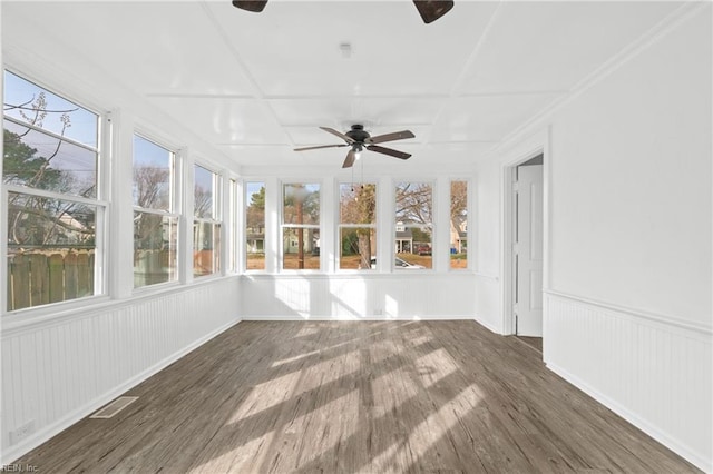 unfurnished sunroom featuring ceiling fan and coffered ceiling