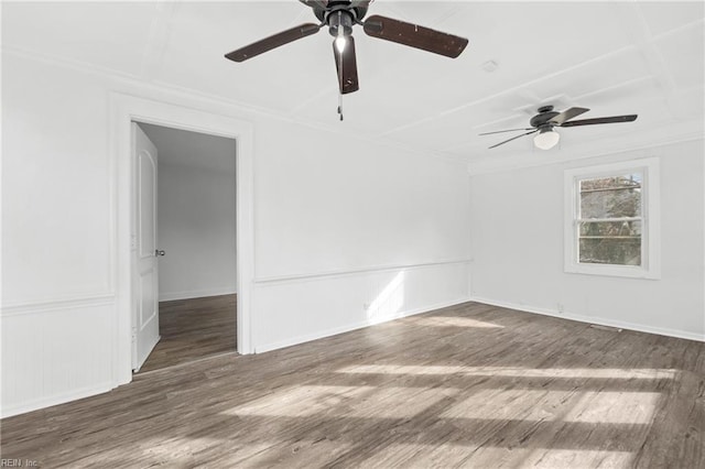 empty room with dark hardwood / wood-style floors and ceiling fan