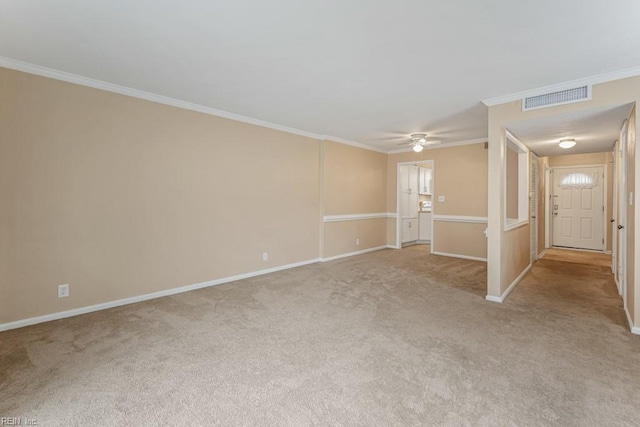 unfurnished living room with ceiling fan, light colored carpet, and ornamental molding