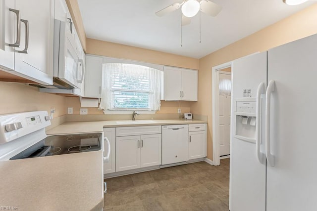 kitchen featuring ceiling fan, sink, white cabinets, and white appliances