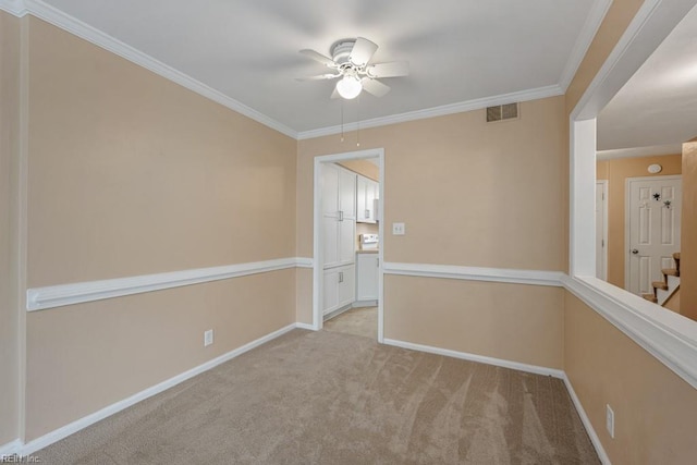 unfurnished room featuring ceiling fan, light colored carpet, and ornamental molding