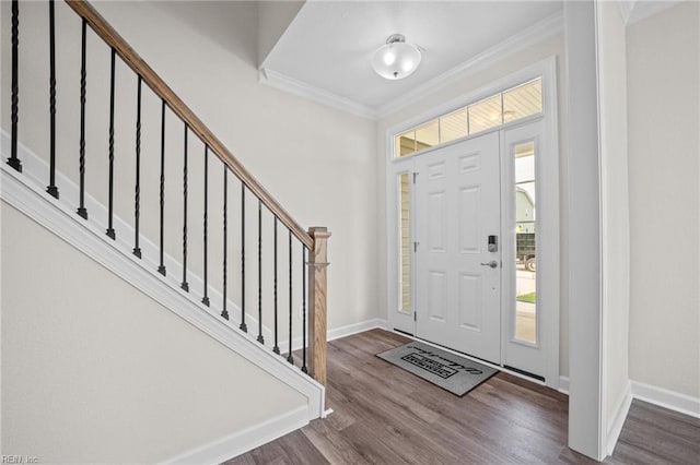 entrance foyer featuring wood-type flooring and ornamental molding