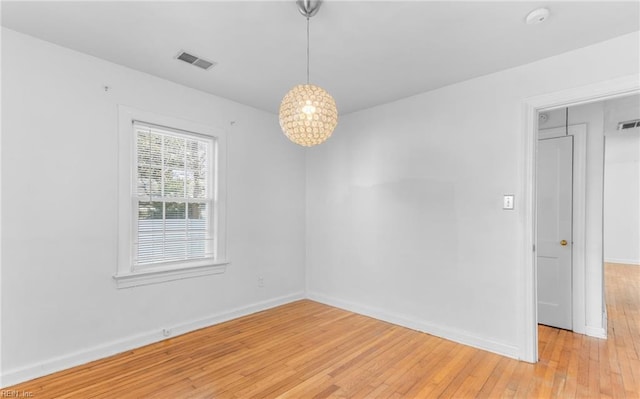 unfurnished room with light hardwood / wood-style flooring