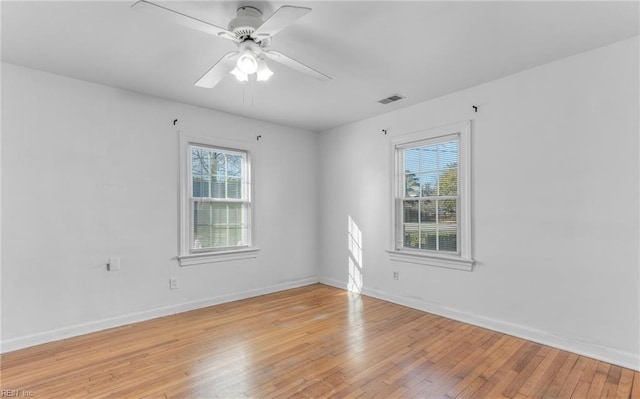 spare room with ceiling fan and light hardwood / wood-style flooring