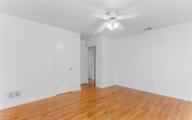 spare room with light hardwood / wood-style flooring and ceiling fan