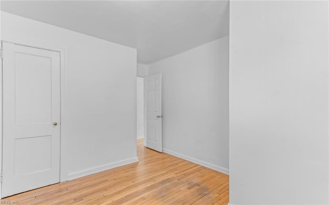 spare room with light wood-type flooring