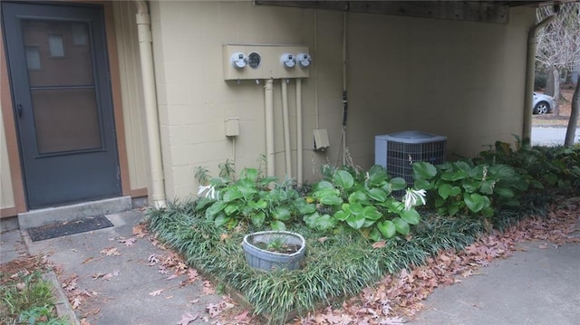 doorway to property featuring central AC unit