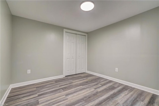 1013 Dare Rd, Yorktown, VA 23692 - unfurnished bedroom with wood finished floors, baseboards, and a closet