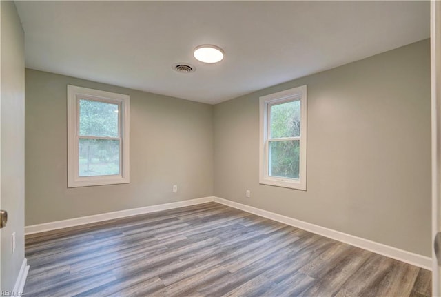 1013 Dare Rd, Yorktown, VA 23692 - spare room with wood finished floors and baseboards